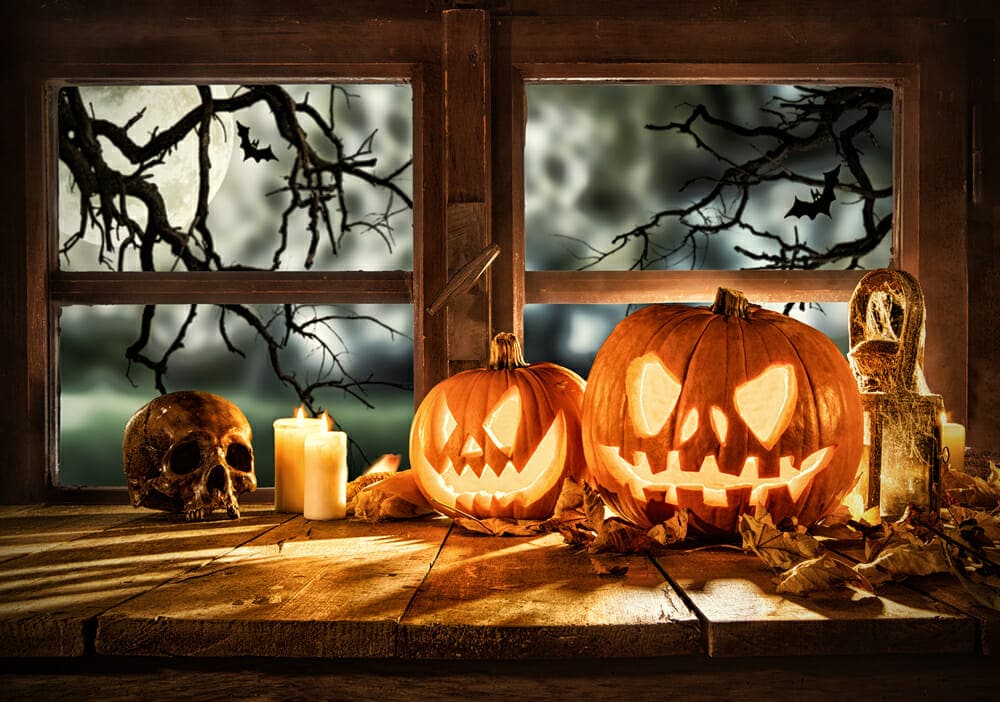 Spooky halloween pumpkins on wooden planks