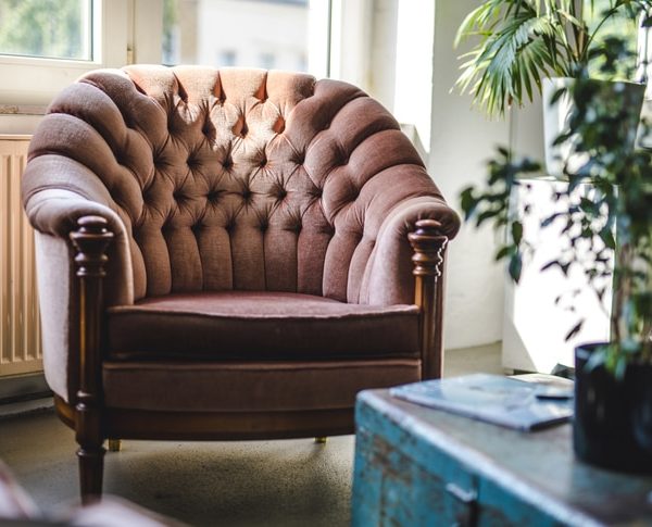 Upholstered Armchair and Trunk in Eclectic Office