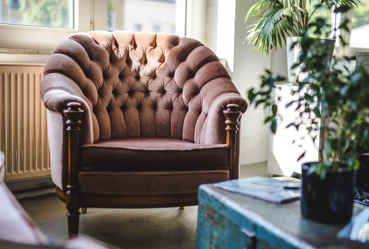 Upholstered Armchair and Trunk in Eclectic Office