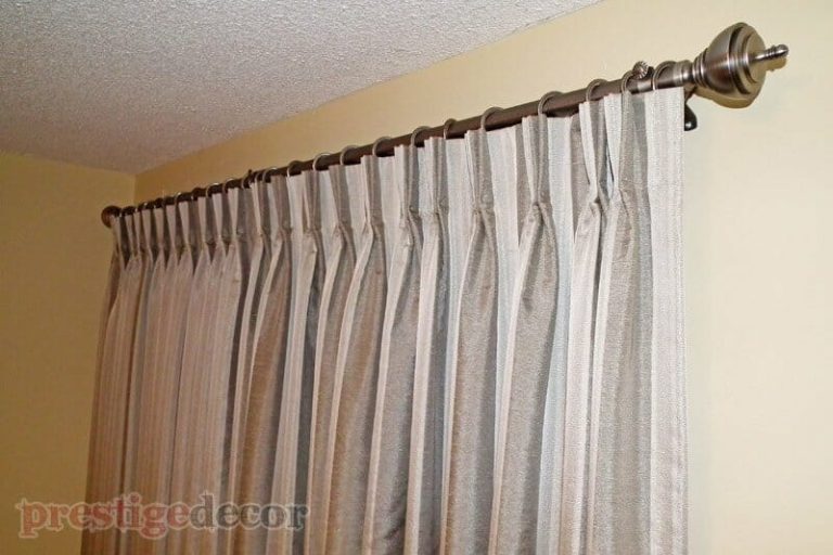Pinch pleat drapes in the master bedroom