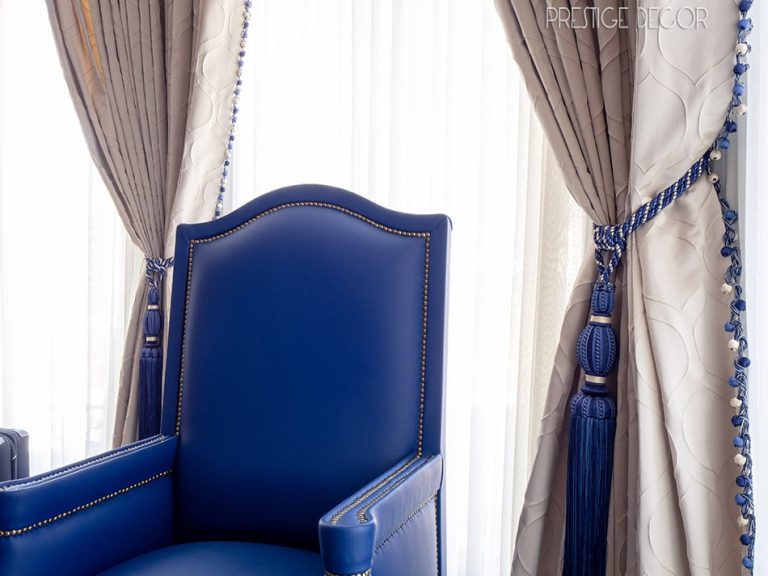 Custom curtains and tiebacks with matching blue upholstery
