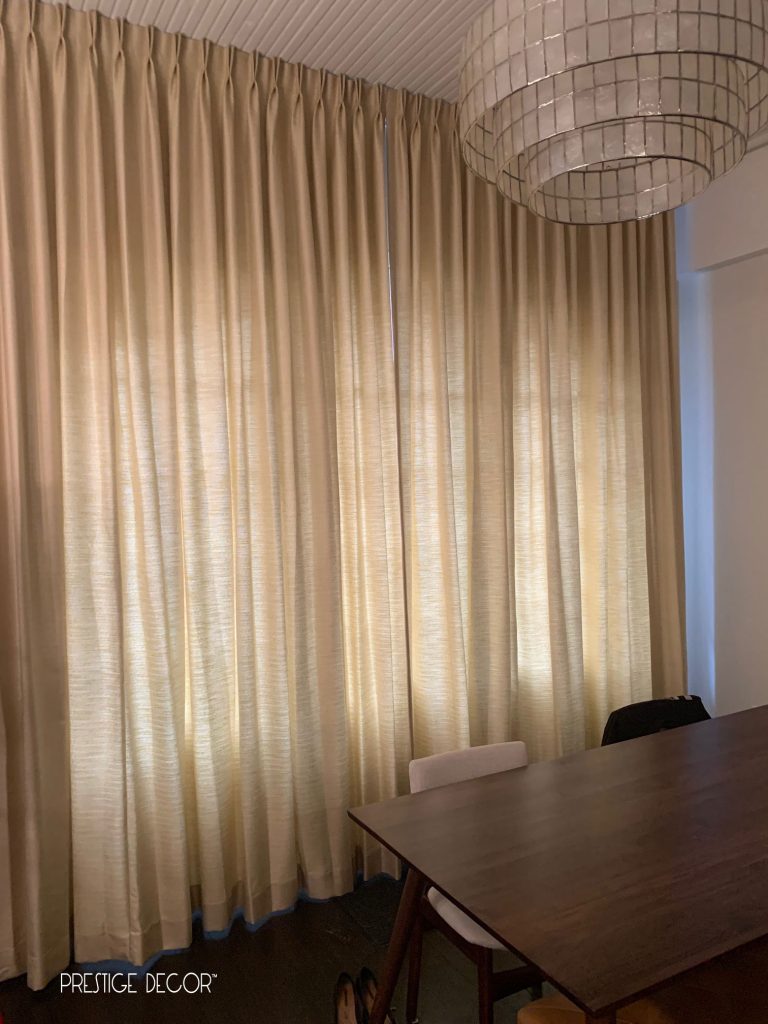 Industrial look townhouse in downtown Toronto with ceiling mounted custom living room draperies on a curtain track. Client wanted to hide the pipes and chose an unlined linen polyester fabric. Curtains in closed position