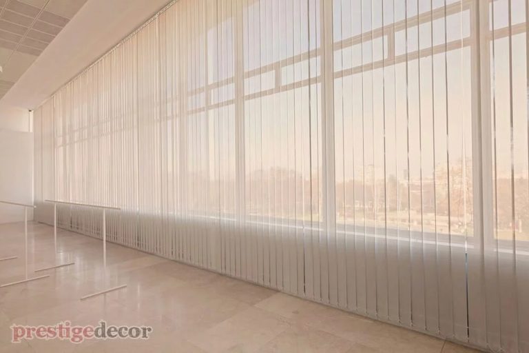 Ballet studio with white sheer curtain fabric on the windows