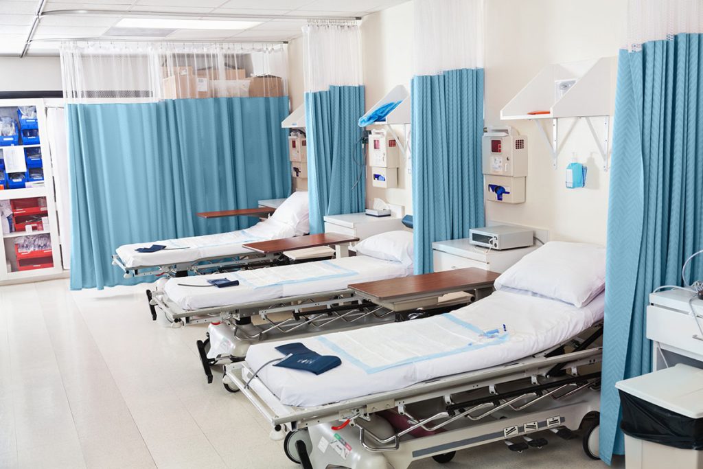 Empty beds ready for patients in hospital surgery recovery room