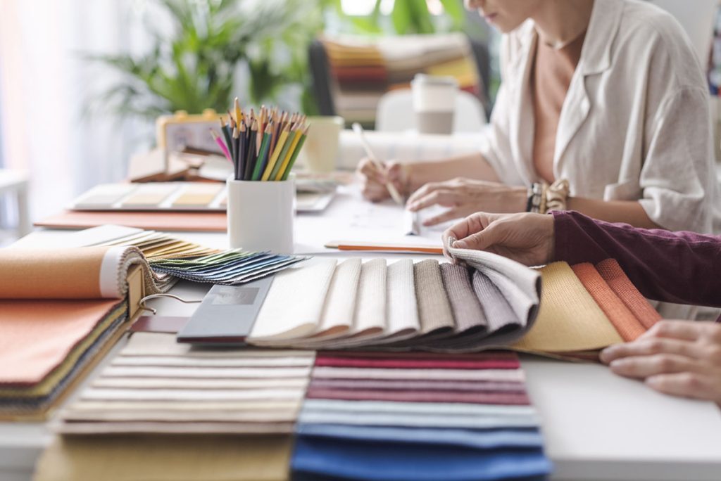 Interior designers checking fabric swatches